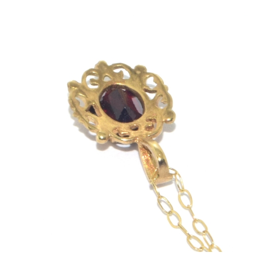 73 - 9ct gold antique garnet and earring suite of jewellery set in a scroll open work design on a 44cm 9c... 