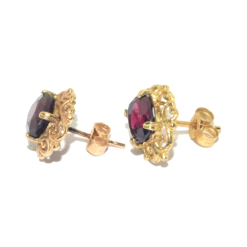 73 - 9ct gold antique garnet and earring suite of jewellery set in a scroll open work design on a 44cm 9c... 