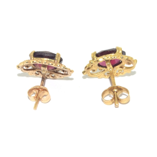 73 - 9ct gold antique garnet and earring suite of jewellery set in a scroll open work design on a 44cm 9c... 