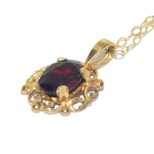 73 - 9ct gold antique garnet and earring suite of jewellery set in a scroll open work design on a 44cm 9c... 