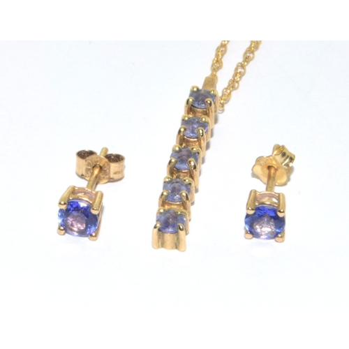 83 - 9ct gold ladies tanzanite 4 stone drop pendant with a pair of Tanzanite stud 9ct gold earrings on a ... 