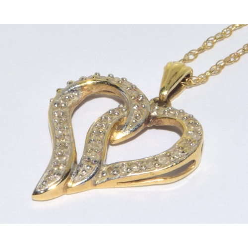 93 - 9ct gold ladies swept heart Diamond pendant necklace on a 42cm 9ct god chain