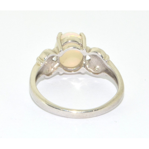 16 - 9ct white gold ladies Opal ring in a scroll setting  size N