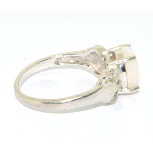 16 - 9ct white gold ladies Opal ring in a scroll setting  size N