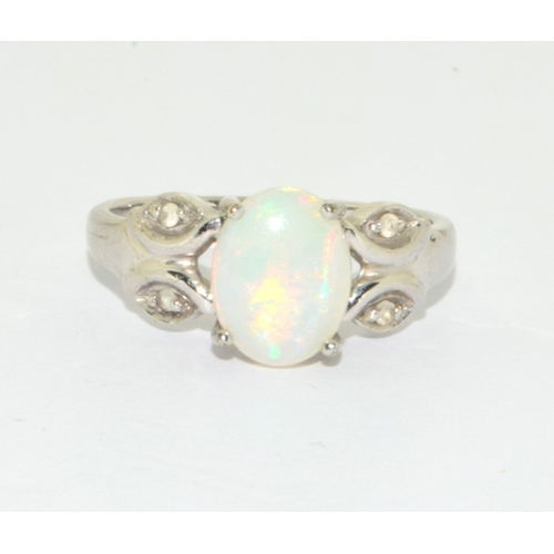 16 - 9ct white gold ladies Opal ring in a scroll setting  size N