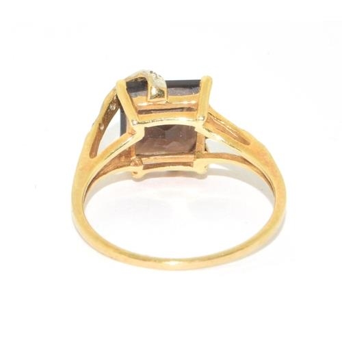 101 - 9ct gold ladies Garnet and Diamond sweep ring is hall marked as diamond in the ring size N