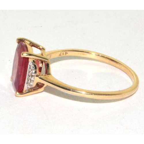 161 - 9ct gold ladies larger ruby and accent Diamond ring size S