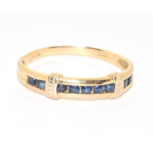 86 - 9ct gold ladies sapphire channel set ring size O