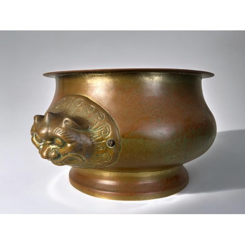 302 - An Oriental large brass Lion mask planter / pot.17 x 33cm