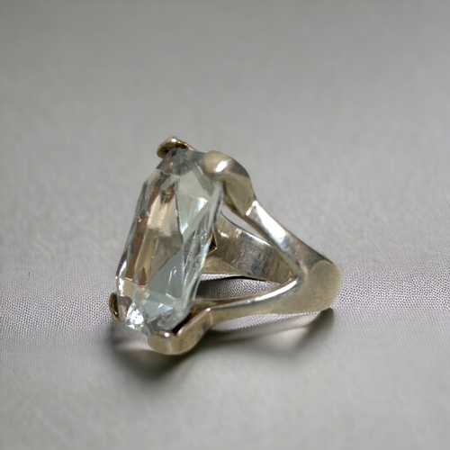 309 - A pierced 925 silver ring. Together with a large white metal oversize ring.