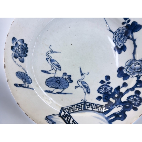 12 - A Chinese porcelain charger.Qing dynasty, Qianlong period.Decorated with Cranes & lilies, border... 