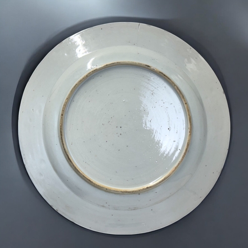 12 - A Chinese porcelain charger.Qing dynasty, Qianlong period.Decorated with Cranes & lilies, border... 