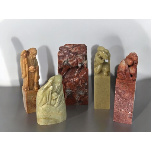 383 - A collection of Chinese carved stone figures and seals.Tallest - 27cm