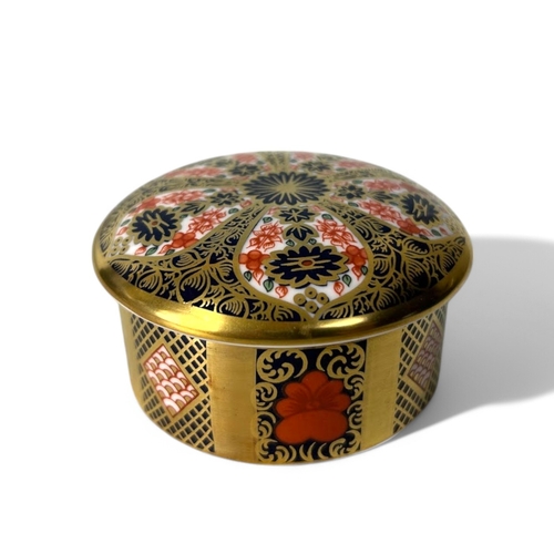 384 - A boxed Royal Crown Derby 'Old Imari' trinket box. together with a pin dish.