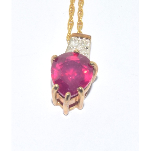 228 - 9ct gold Ruby and Diamond pendant necklace on a 50cm 9ct gold chain