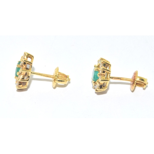 155 - Superb quality 18ct gold Emerald and Diamond halo design earrings each with screw back and butterfli... 