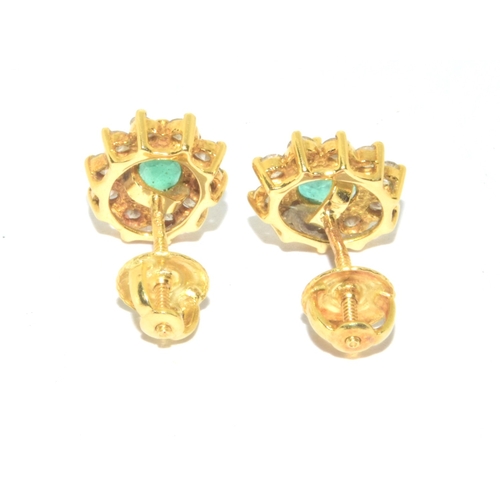 155 - Superb quality 18ct gold Emerald and Diamond halo design earrings each with screw back and butterfli... 