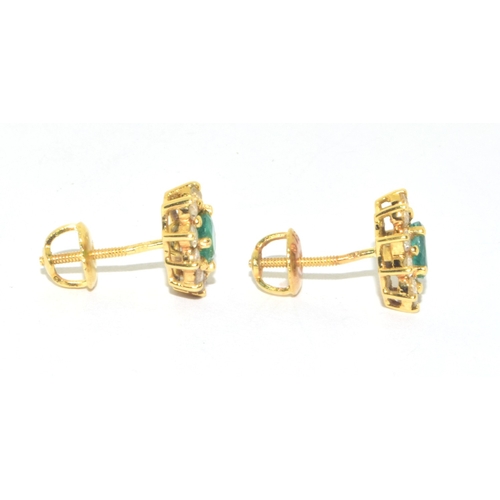 155 - Superb quality 18ct gold Emerald and Diamond halo design earrings each with screw back and butterfli... 