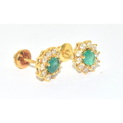 155 - Superb quality 18ct gold Emerald and Diamond halo design earrings each with screw back and butterfli... 