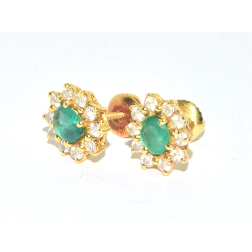 155 - Superb quality 18ct gold Emerald and Diamond halo design earrings each with screw back and butterfli... 