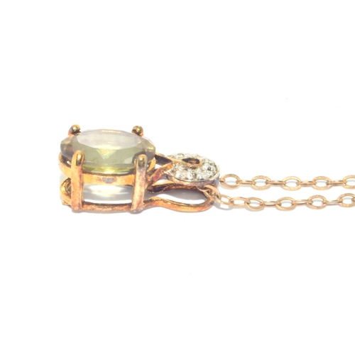 78 - 9ct gold Peridot and Diamond pendant necklace on a 40cm 9ct gold chain