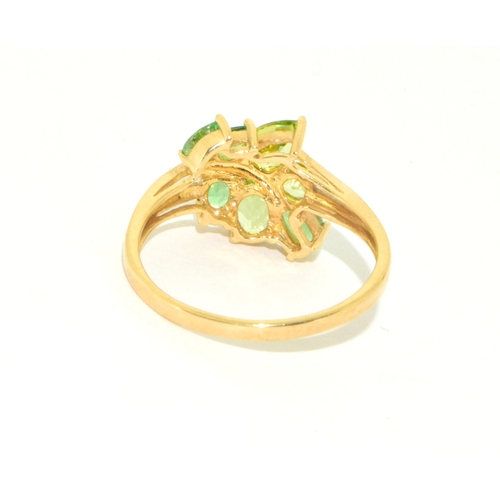 41 - 9ct gold ladies peridot and gem stone leaf design statement ring size S