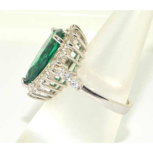 50 - 925 silver ladies Emerald green gem stone pear shape ring in a halo design set in an open claw setti... 