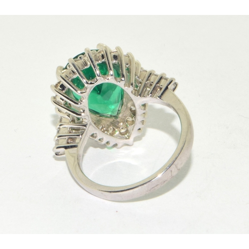 50 - 925 silver ladies Emerald green gem stone pear shape ring in a halo design set in an open claw setti... 