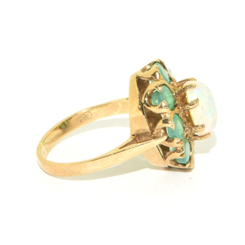 61 - 9ct gold ladies vintage Emerald and Opal cluster ring held in a box claw setting size K