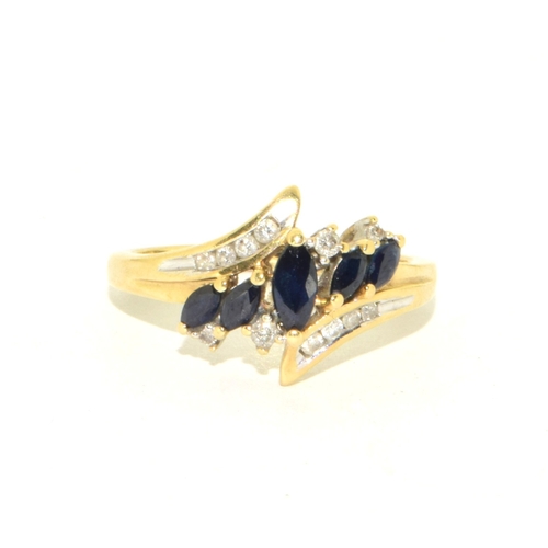 66 - 9ct gold ladies Diamond and Sapphire twist design ring size O