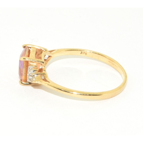 71 - 9ct gold ladies facet faced Amber coloured ring with accent diamond shoulders size R