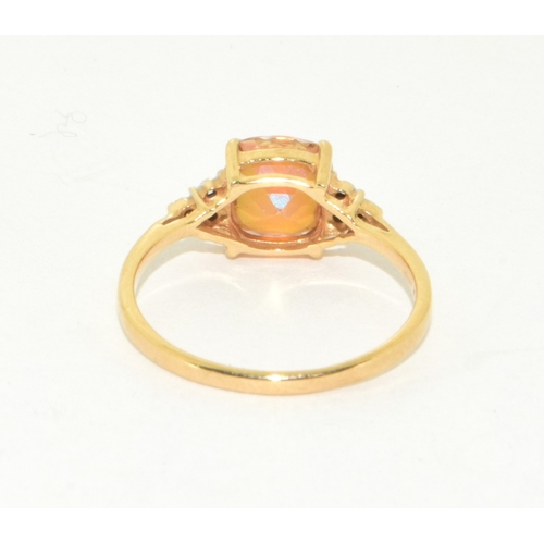 71 - 9ct gold ladies facet faced Amber coloured ring with accent diamond shoulders size R