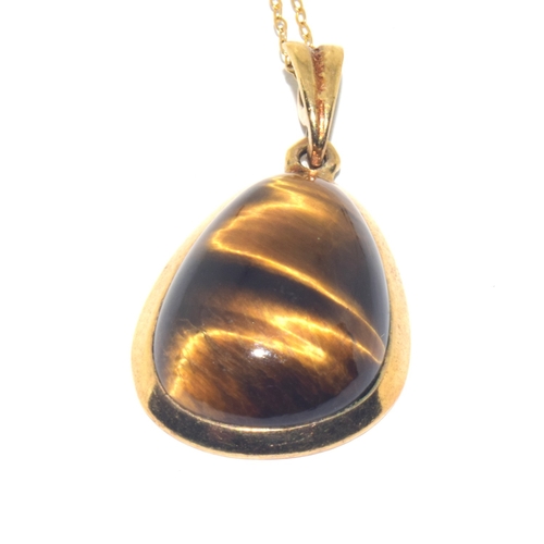 73 - 9ct gold large Tigers Eye pendant necklace on a 9ct gold chain of 48cm