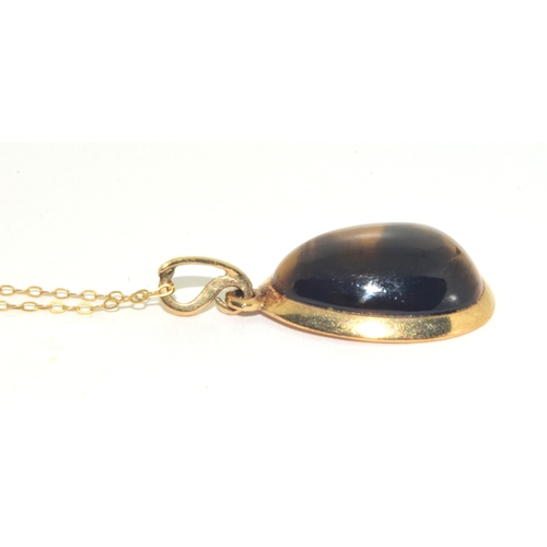 73 - 9ct gold large Tigers Eye pendant necklace on a 9ct gold chain of 48cm