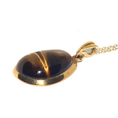 73 - 9ct gold large Tigers Eye pendant necklace on a 9ct gold chain of 48cm