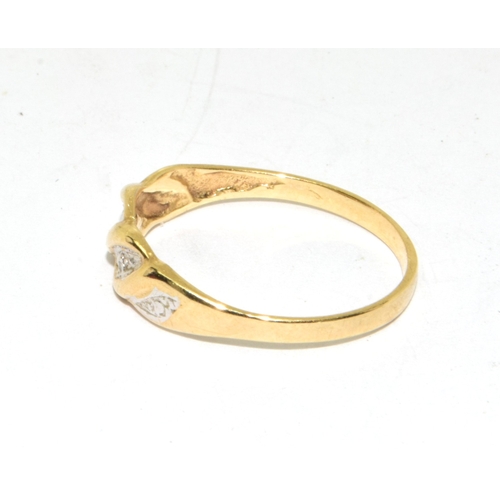 91 - 9ct gold ladies Diamond ring in a wave setting size N