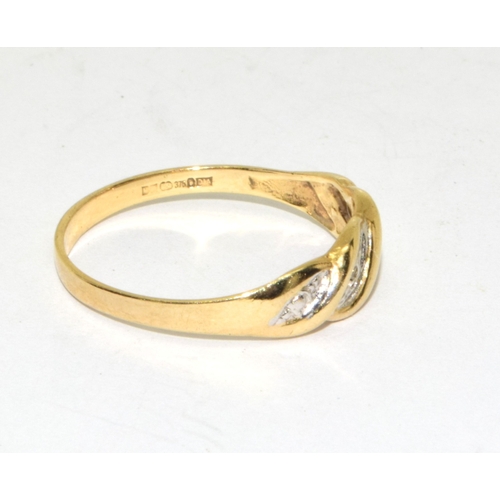 91 - 9ct gold ladies Diamond ring in a wave setting size N