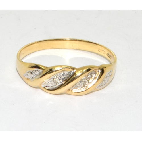 91 - 9ct gold ladies Diamond ring in a wave setting size N