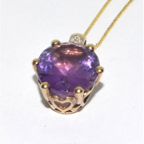 98 - 9ct gold oval cut Amethyst and Diamond pendant necklace on a 9ct gold chain of 42cm