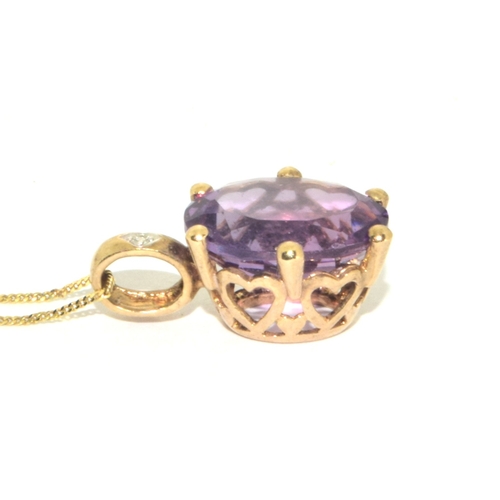 98 - 9ct gold oval cut Amethyst and Diamond pendant necklace on a 9ct gold chain of 42cm