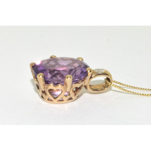 98 - 9ct gold oval cut Amethyst and Diamond pendant necklace on a 9ct gold chain of 42cm