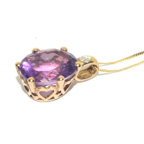 98 - 9ct gold oval cut Amethyst and Diamond pendant necklace on a 9ct gold chain of 42cm