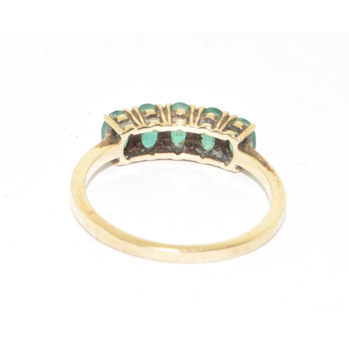 111 - 9ct gold ladies 5 stone Emerald ring size N