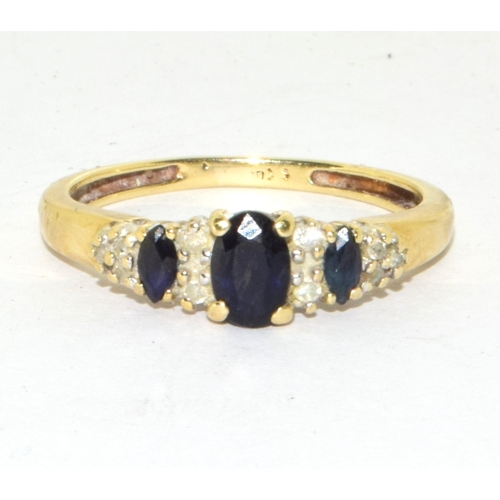 121 - 9ct gold ladies Diamond and sapphire graduated ring size O