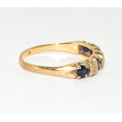 136 - 9ct gold ladies vintage 7 stone Diamond and Sapphire ring in a scroll setting size P