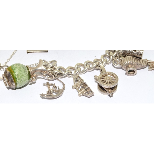 140 - Large heavy 925 silver charm bracelet and 14charms some articulated with heart padlock and safety ch... 