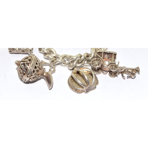 140 - Large heavy 925 silver charm bracelet and 14charms some articulated with heart padlock and safety ch... 