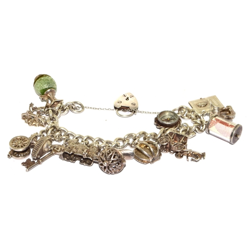 140 - Large heavy 925 silver charm bracelet and 14charms some articulated with heart padlock and safety ch... 