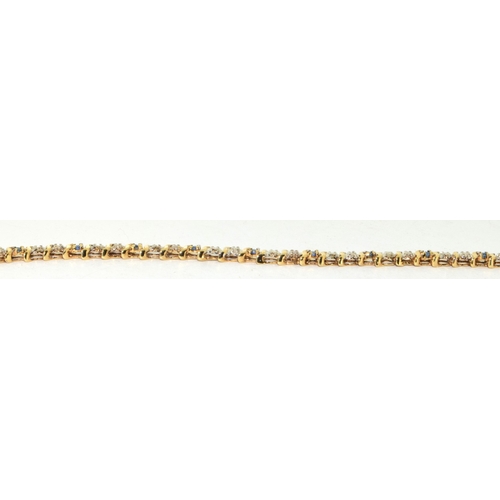 193 - 9ct gold Diamond and Sapphire line bracelet 20cm long 6.7g