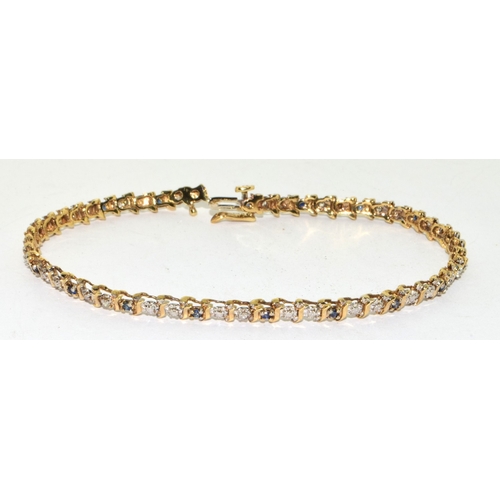 193 - 9ct gold Diamond and Sapphire line bracelet 20cm long 6.7g